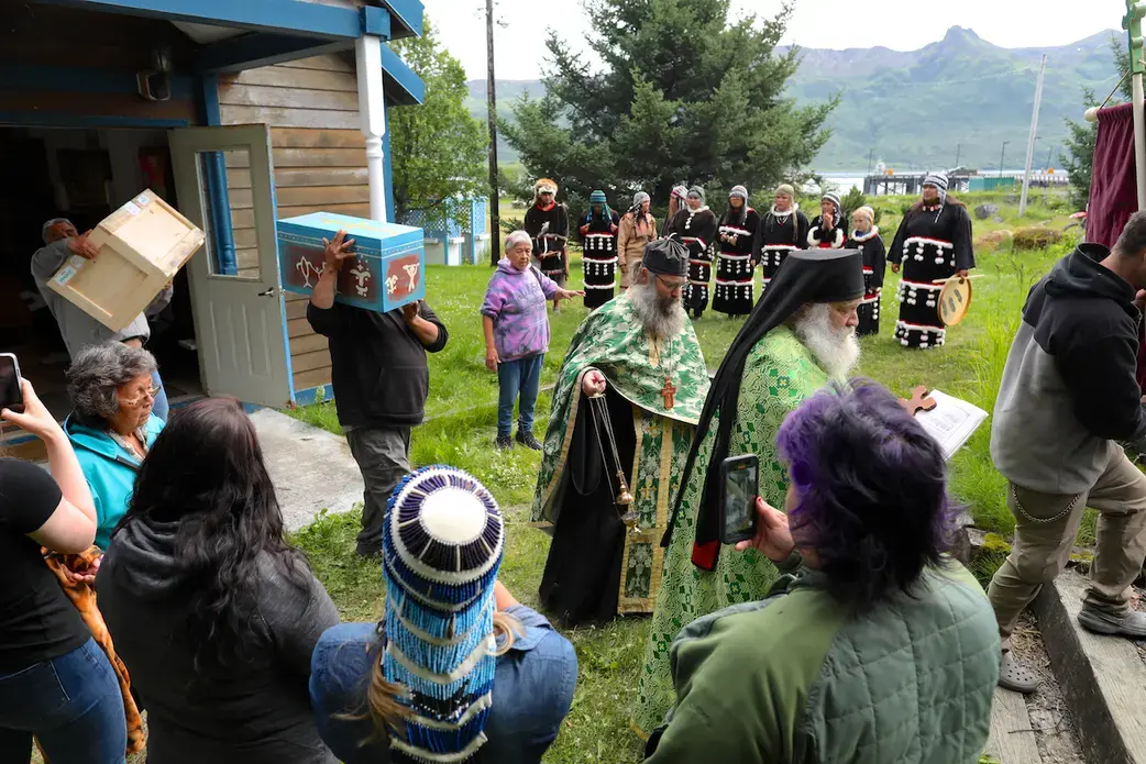 AnastasiaCoffin1 A man carries a small blue coffin at a Native American ceremony
