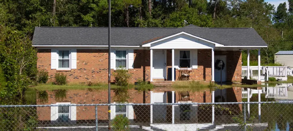 Flood waters backing up on a bridge just south of Raeford, North Carolina, after Hurricane Florence. United States, 2018.