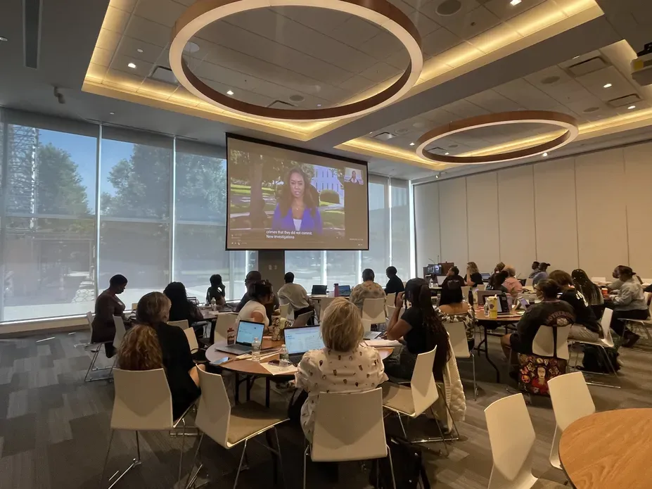 Ashonti Ford's presentation is projected to a room of teachers