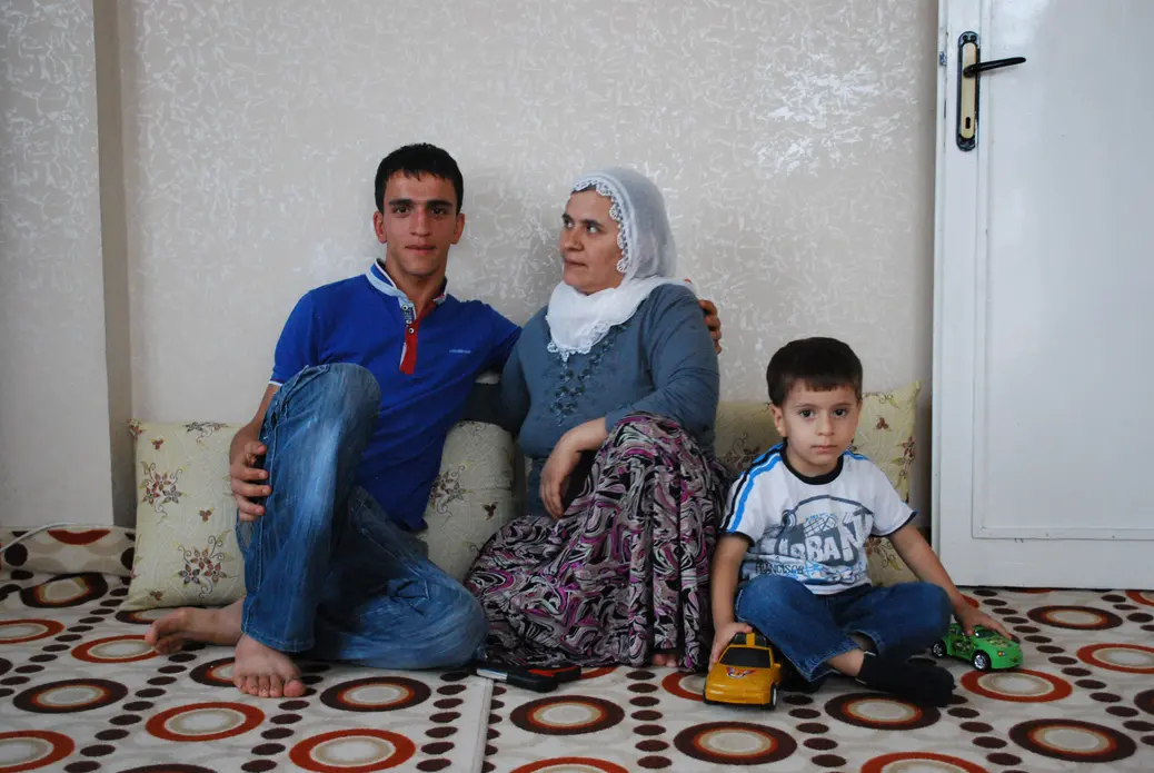 Ferman, his mother, and her son. Image by Jenna Krajeski. Turkey, 2011. Media file: 3boys1.jpg