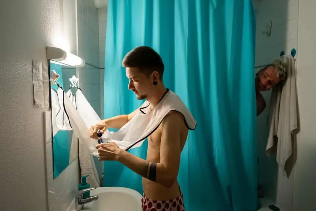 Faced with increasing levels of abuse in their hometown of Odessa, Ukraine, Sergi and his boyfriend Igor moved to Besançon, France. Igor had been attacked at a Pride march in Odessa, an incident that left him with head wounds and needing glasses. He and Sergi were chased in the streets in their home town by men shouting, ‘Death to faggots!’ and they began receiving death threats. Image by Bradley Secker. France, 2020.