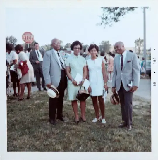 Judy Gladney, second from right, in a photograph with her grandfather, far left, Dr. R. B. Taylor, and her parents, Clarice and Dr. John Gladney, at her University City High School graduation in July of 1969. Image courtesy of Judy Gladney. United States, 1969.