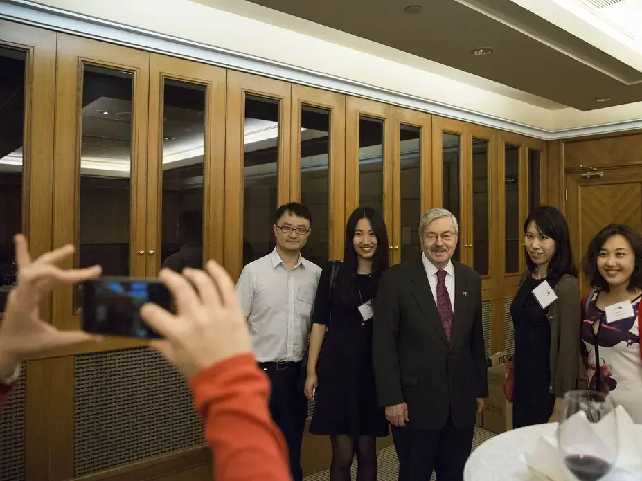 Terry Branstad, U.S. ambassador to China poses for photos during an Iowa Sister States reception on Wednesday, Sept. 20, 2017, in Beijing, China. Image by Kelsey Kremer. China, 2017.