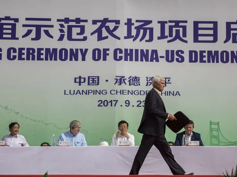 Rick Kimberley, a fifth generation family farmer from rural Maxwell, walks across the stage to speak during the groundbreaking of the China-U.S. Demonstration Farm on Saturday, Sept. 23, 2017, in Luanping County, Hebei, China. The farm in China will be modeled after Kimberley's farm in Iowa. Image by Kelsey Kremer.