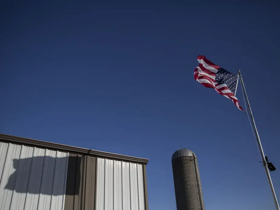 An American flag blows in the wind on a fall day at the Kimberley farm, on Tuesday, Oct. 17, 2017, outside of Maxwell. Image by Kelsey Kremer.