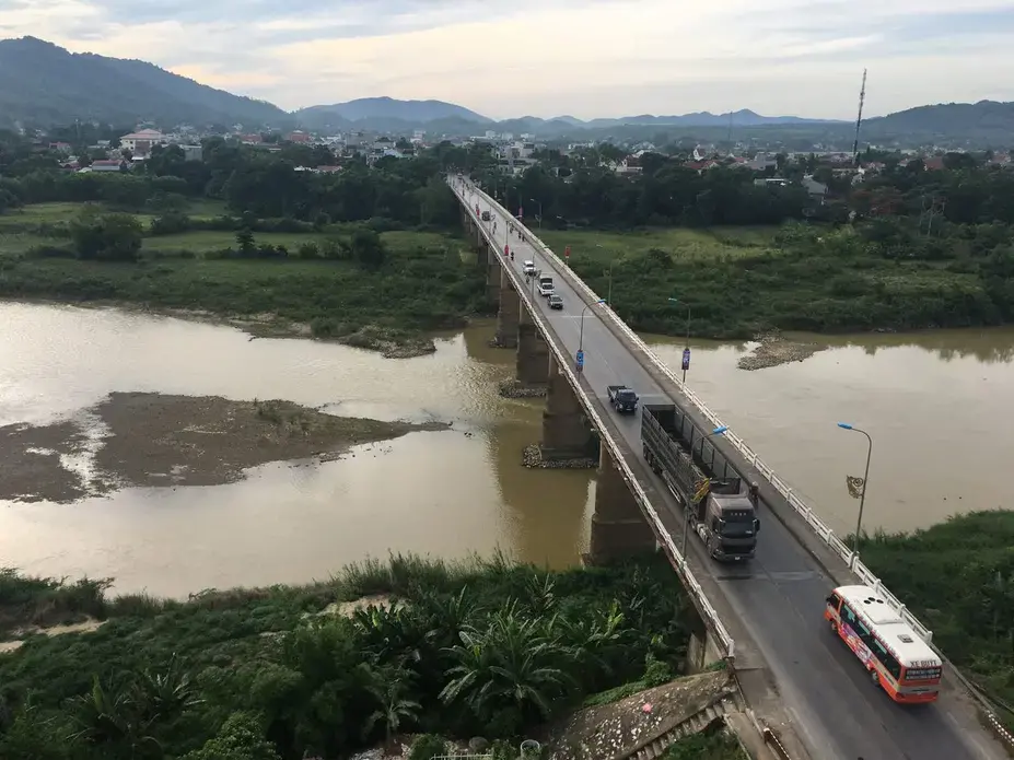 A bridge over Song Hieu River is shown June 12 in the small city of Thai Hoa, Vietnam. It is about 150 miles south of the capital of Hanoi, a five-hour drive. Image by Mark Hoffman. Vietnam, 2019. 