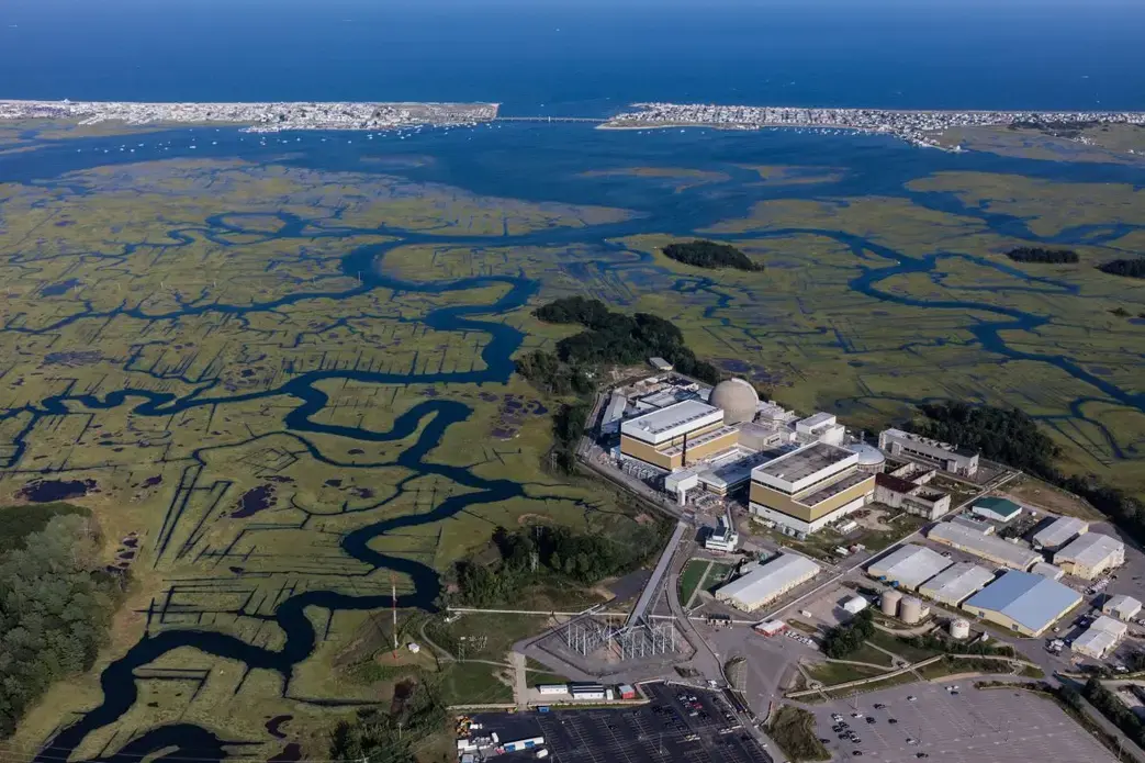 The Seabrook Nuclear Generating Station, built alongside a marsh on the coast of New Hampshire, is considered one of the four reactors most at risk of flooding in the United States. Image by Alex MacLean. United States, 2019.