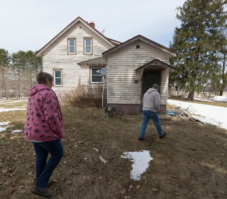 Betty Jo Johnson and Bruce Drinkman arrive to start repairing the circa-1930 house on his farm in Ridgeland. His new farm is named “Tryin' Again Dairy.” Image by Mark Hoffman. United States, 2019.