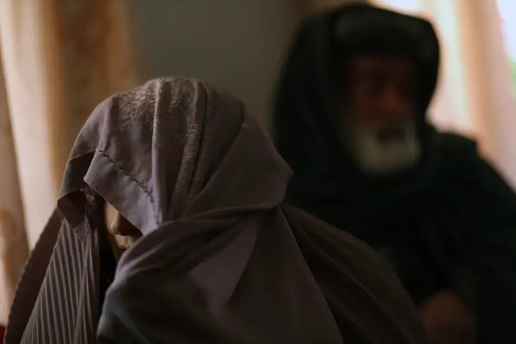 Zarmina Shehadi's mother Simin Gula and father Khel Mohammad. They denied that Zarmina wrote poetry or that her death was suicide. “It was an accident. She was trying to get warm after a bath, but the firewood was wet, so she poured petrol on it and caught herself on fire.” And no, her daughter absolutely did not like writing or reading or poetry, her mother argued. “She was a good girl, an uneducated girl. She was a good tailor. Our girls don’t want to go to school." Image by Seamus Murphy. Afghanistan, 2012. Media file: AfghanPoetry_Pulitzer_SeamusMurphy026.JPG