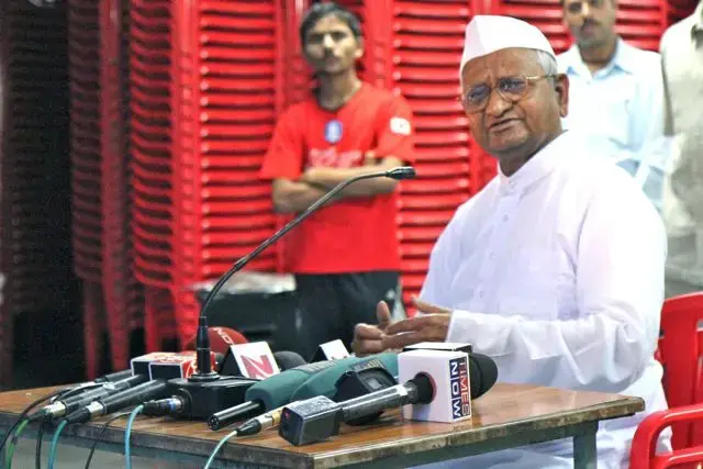 Anti-corruption leader Anna Hazare speaks with supporters in Ralegan Siddhi, his hometown in western India. Image by Jon Sawyer. India, 2011. Anna Hazare speaks with supporters in Ralegan Siddhi in India.