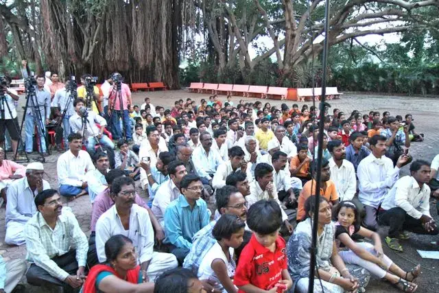 Supporters and news media at an address by Anna Hazare