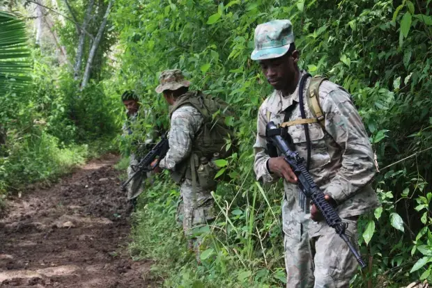 Special forces troops from Belize's Special Assignment Group on patrol near the border with Guatemala. Image by Nick Miroff. Belize, 2011. Media file: Belize CPI 4 (4)jungle.jpg