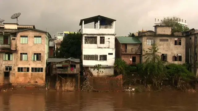 Houses on the Moei River in Mayawatti, Burma. Thailand, 2011.