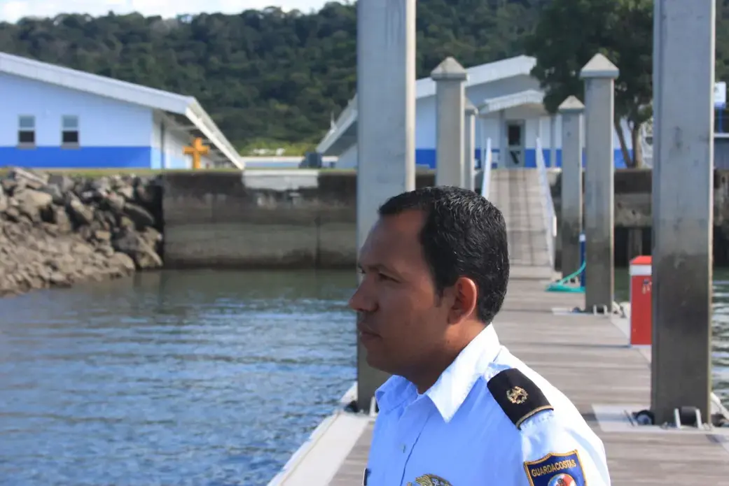 Coast Guard officer Edwin Cantillo on the docks of a new U.S.-financed $3 million station at Puerto Caldera on Costa Rica's Pacific coast. Image by Nick Miroff. Costa Rica, 2011. Media file: CR_Guardacostas.jpg