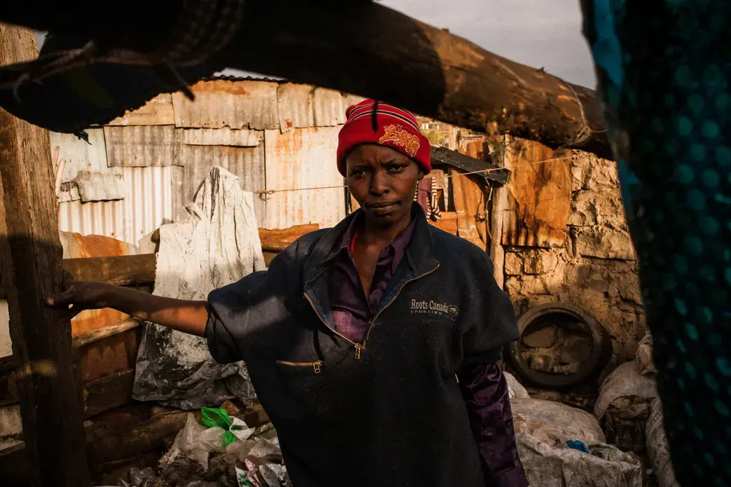 Rahab Rujuru, 42, a mother of six children between the ages of four and seventeen, moved to a small home directly bordering Dandora after the country’s 2007 post-election violence forced her family to leave their Eldoret farm near the western border of Kenya. Image by Micah Albert. Kenya, 2012. Media file: Dandora-8.jpg