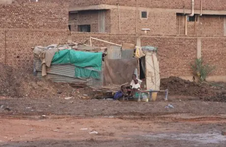 A displaced southerner's makeshift structure in Khartoum Media file: Displaced Southerner in Sudan.jpg