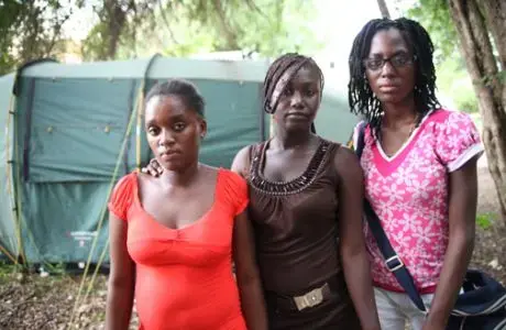 Phara, Malia and Edeline, three Haitian girls orphaned by HIV/AIDS who Lisa Armstrong interviewed during the summer of 2010. Image by Andre Lambertson. Haiti, 2010.