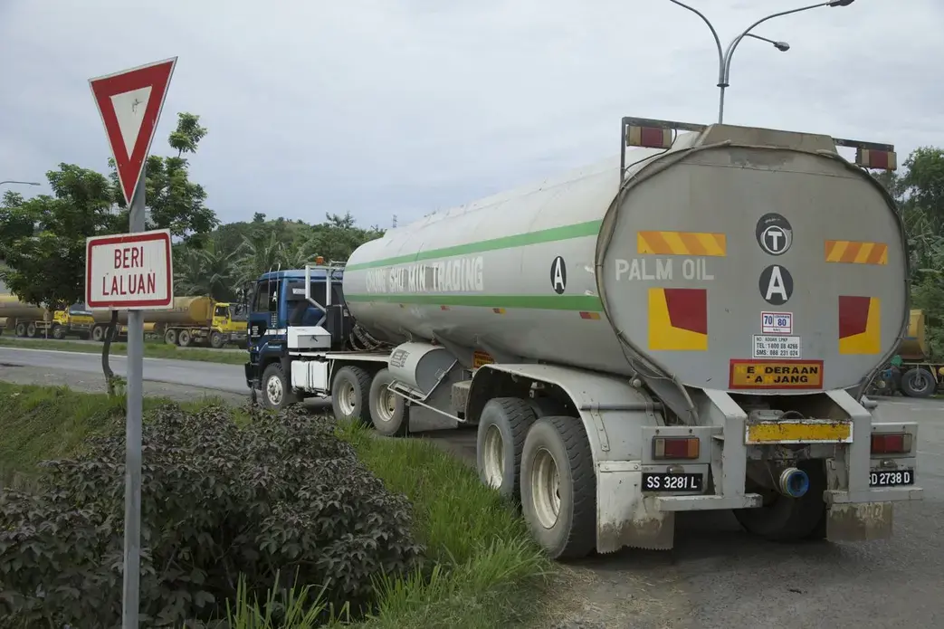 A tanker delivers a load of palm oil to a refinery complex on the outskirts of Lahad Datu, in Malaysian Borneo's Sabah province. Image by Jason Motlagh. Malaysia, 2012. Media file: IMG_9021.jpg