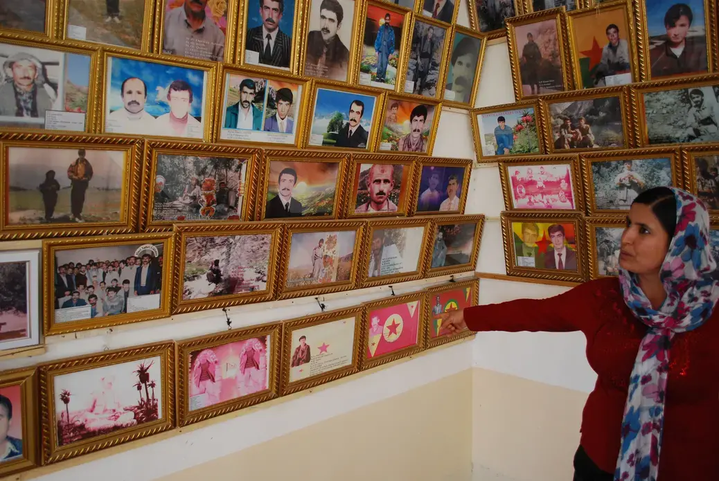 A woman from the Makhmour refugee camp at a memorial for refugees killed while fighting for the PKK, or in PKK-related violence. Image by Jenna Krajeski. Iraq, 2012. Media file: Iraq-Kurdistan.JPG