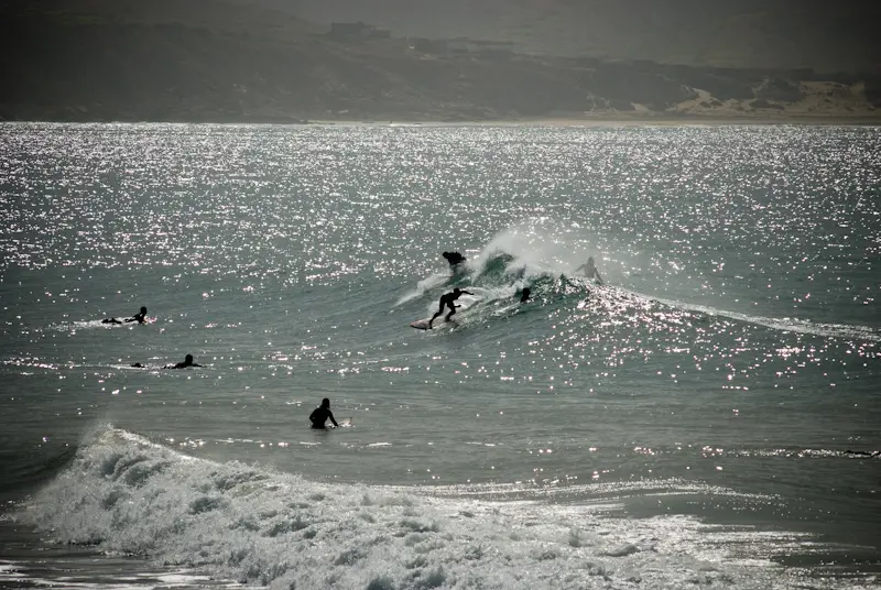 Surfers riding the waves in Morocco.