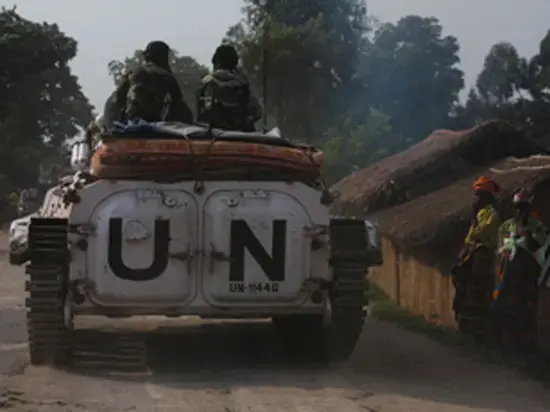 A 6 p.m. curfew was initiated for fear that vehicles of the United Nations might be attacked. Image by Michael Kavanagh. Congo, 2008. Media file: Kavanagh-UN-peacekeeping-Rwanda.jpg