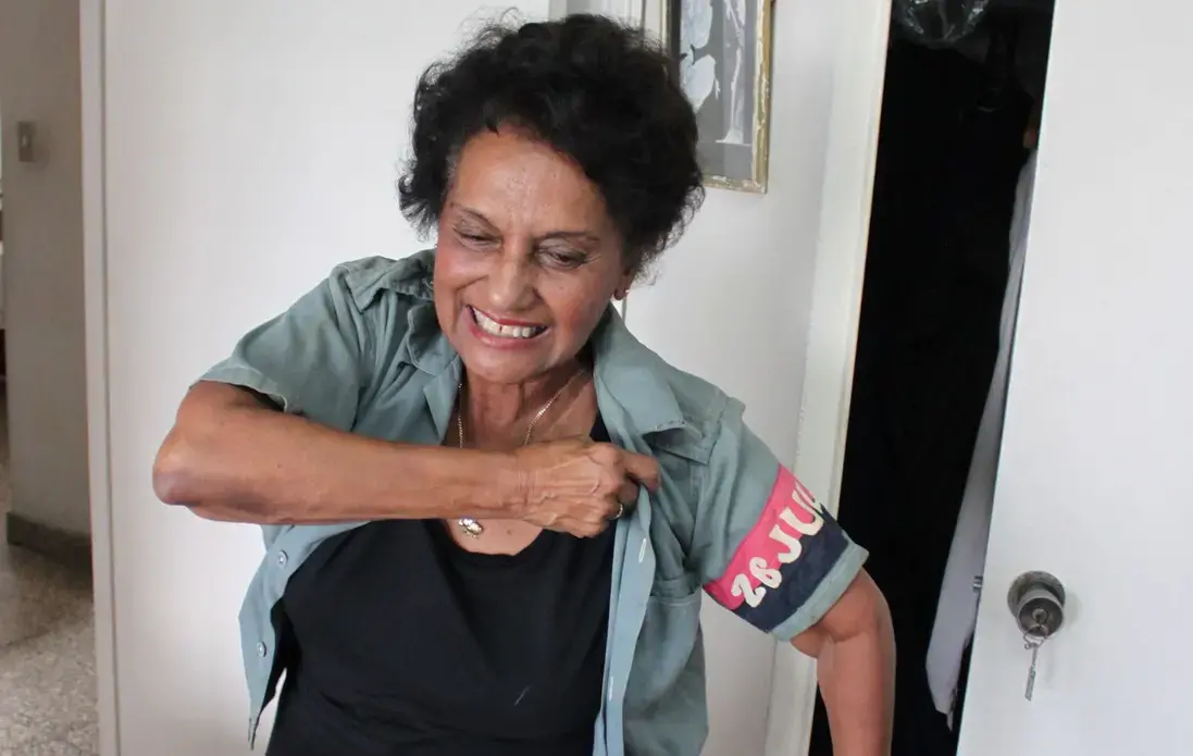 Marta Rojas dons a 51-year-old blouse from Cuba's July 26 Movement.