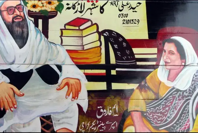 Assassinated political leader Benazir Bhutto is depicted on back of truck seated with her spiritual leader. Image by Sarah Stuteville for GlobalPost. Media file: PAKISTAN_05_18_09_Stuteville_Truckart4_EDIT.jpg