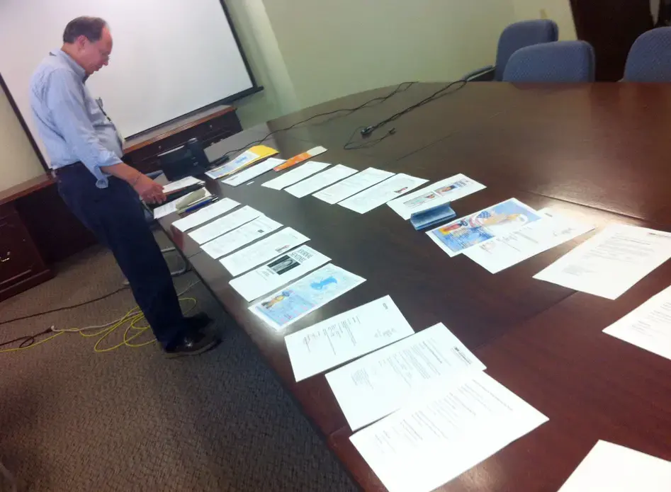 Paper trail: Going through the final checklist for each document we needed for our visa application. Image by Mike De Sisti. USA, 2012. Media file: Paper Blog 3 photo.JPG