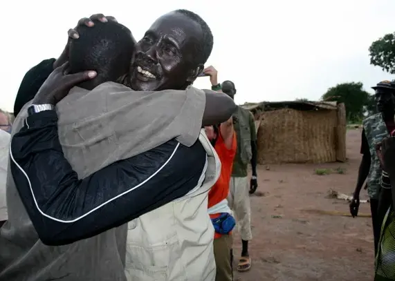 Koor meets his father for the first time in almost 20 years. Photo by Gabriel Bol Deng, H.O.P.E., gaboldeng@yahoo.com. 1