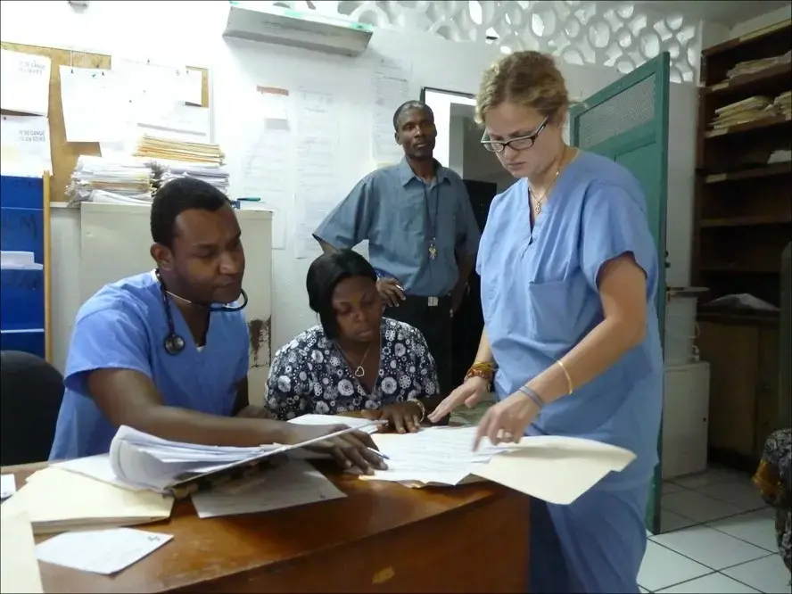 Doctors and nurses prepare the day's rounds of chemotherapy on cancer patients at Zanmi Lasante's clinic. Image by Ansel Herz. Haiti, 2012. Media file: Screen Shot 2012-12-04 at 10.00.05 AM.jpg