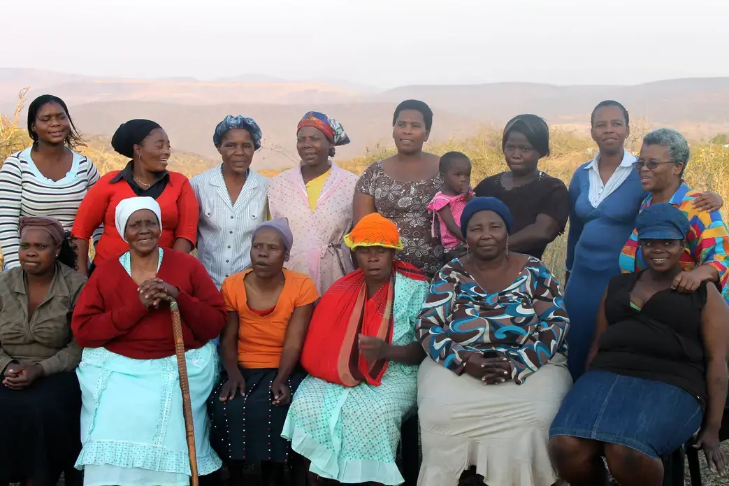 Members of the Rural Women's Movement gather at a home in Ulundi to share their stories. Many of these members have survived years of abuse, and yet they continue fighting for equal rights. Image by Melissa Turley. South Africa, 2012. Media file: Women_Unluni.jpg