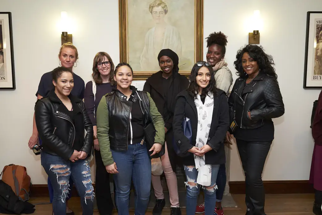 Guttman Community College students gather alongside Guttman Community College interdisciplinary studies instructor, Katie Wilson, following a panel at the Roosevelt House in New York which focused on the global impact of the refugee crisis. Image by Matt Capowski. United States, 2017.