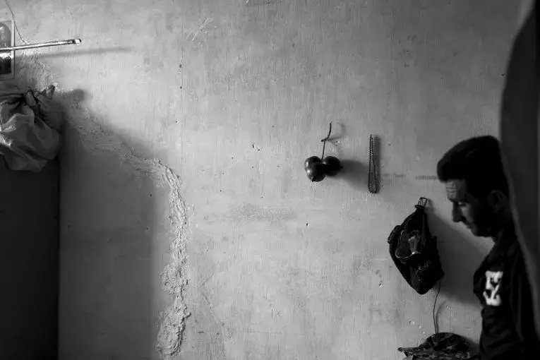 Inside a house in Chah Deraz village, near Lake Bakhtegan. As is seen by the crack in the wall, the houses in the village are being damaged by the drought. Image by Ako Salemi. Iran, 2016.