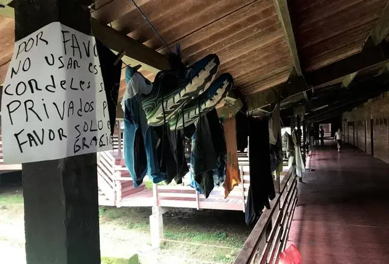 A sign on one of the halls of the camp in Gualaca, Panama asks other residents to please not use this particular clothes line to hang laundry since it's intended for private use. Image by Mario J. Pentón. Panama, 2017.
