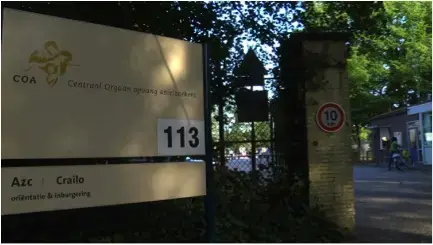 Entrance to former military base that is now a refugee camp in Bussum Zuid. Image by Micah Fink. The Netherlands, 2009. Media file: campcrailo.jpg