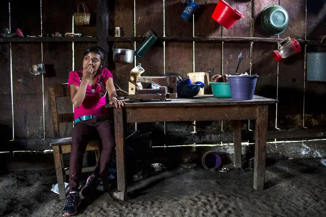 Candelaria López, 15, at home in Yalambojoch, stays at home to help raise her siblings. She no longer goes to school because her family can’t afford to pay the $60 school fee. Image by Simone Dalmasso / The Arizona Daily Star. Guatemala, 2019. Candelaria López, 15, at home in Yalambojoch, stays at home to help raise her siblings. She no longer goes to school because her family can’t afford to pay the $60 school fee. Image by Simone Dalmasso / The Arizona Daily Star. Guatemala, 2019.