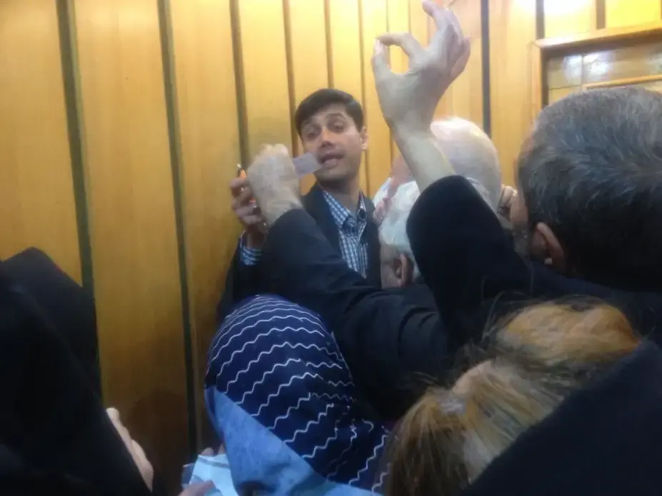 Parliamentary candidate Sayed Miaad Salehi is mobbed by supporters. Image courtesy of Reese Erlich. Iran, 2020. Parliamentary candidate Sayed Miaad Salehi is mobbed by supporters. Image courtesy of Reese Erlich. Iran, 2020.