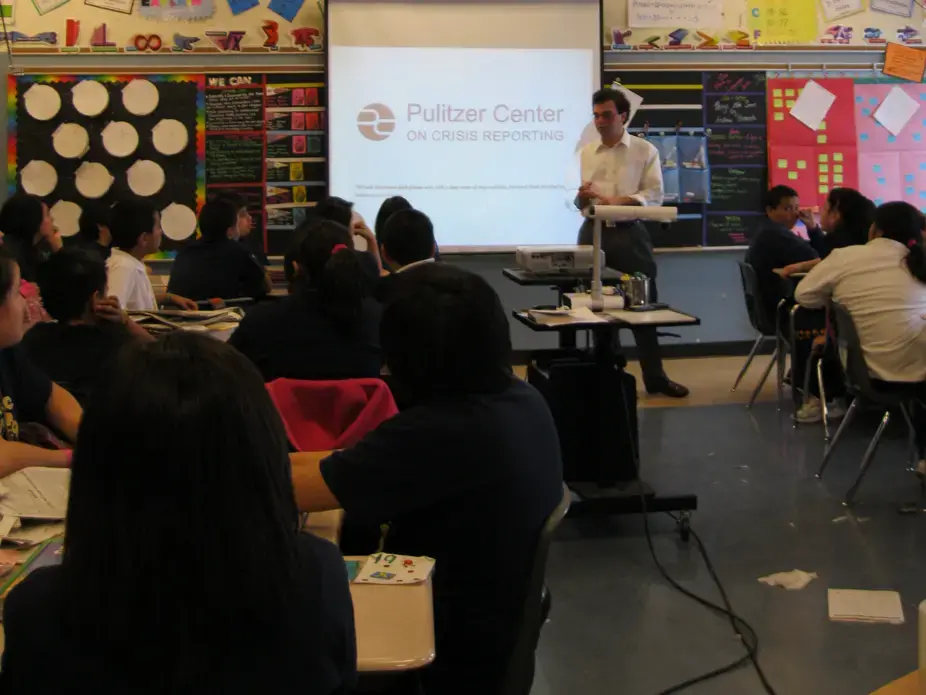 Special Projects Coordinator Peter Sawyer speaks with sixth grade students at Columbia Explorers Academy in Chicago. Image by Kate Seche. Chicago, 2011. image