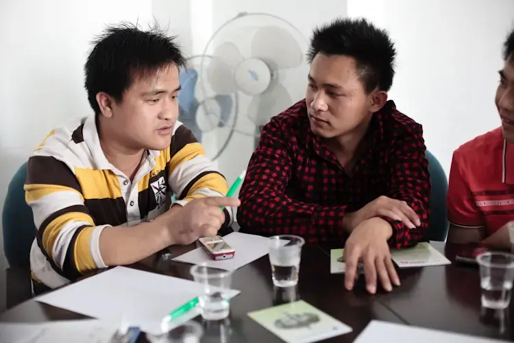 Migrant workers attend a safety training session at China Labor Watch on  February 27, 2011 in Shenzhen, Guangdong Province. The majority of participants in this session had sustained serious hand injuries at work. Image by Jocelyn Baun. China, 2011.