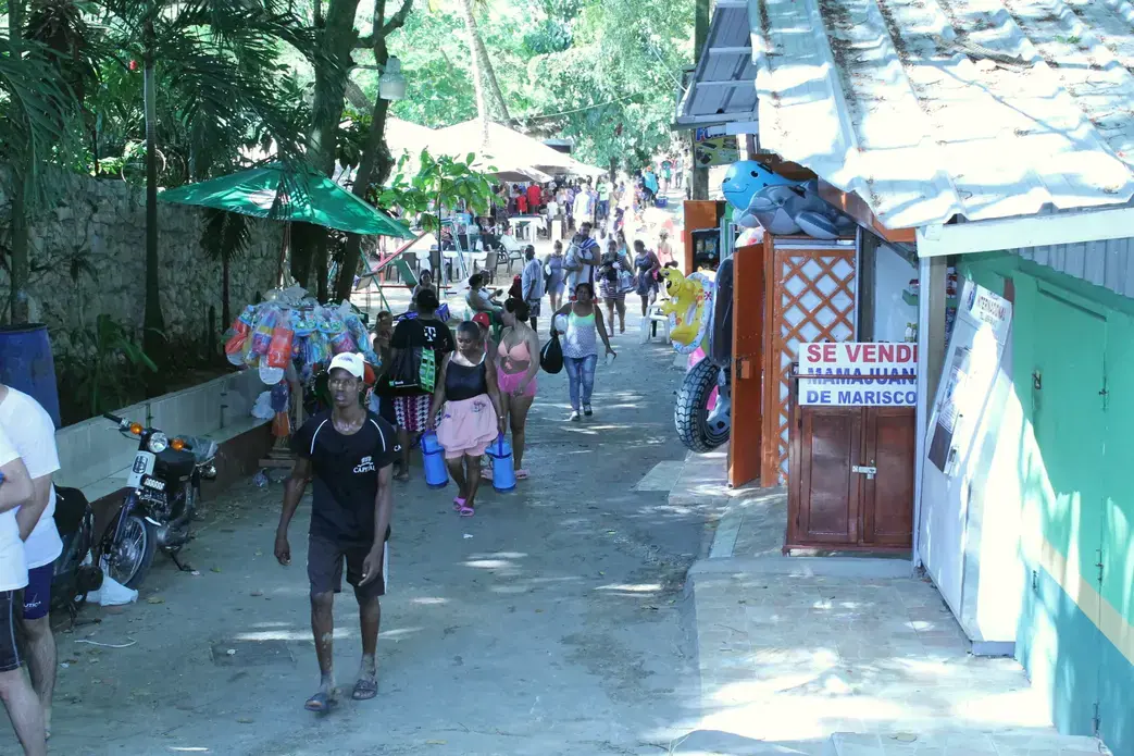 At the main beach in Sosua, Dominican Republic, there are hundreds of shacks selling food, drinks and souvenirs. Sex workers walk around trying to find clients. But local officials have said they want to regulate or diminish the town’s sex industry and encourage family tourism. Image by Emily Codik. Dominican Republic, 2017.