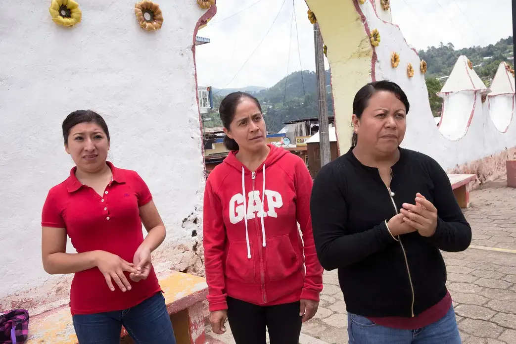 Blanca Hernández, center, worked on a farm in Wisconsin for several years before returning to her home in Texhuacán, Mexico. Image by Rick Barrett. Mexico, 2019.