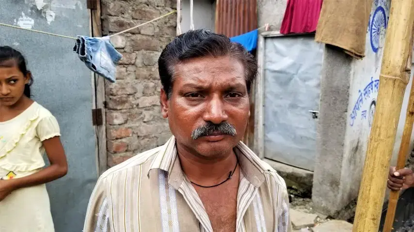 Dalit sewage cleaner, who is on the lowest rungs of so-called "untouchables." Image by Phillip Martin/WGBH News. India, 2019.