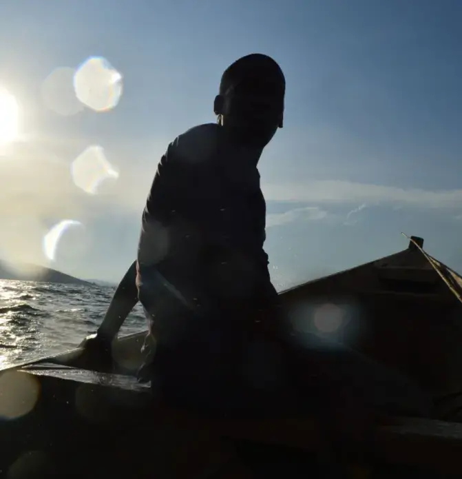 Traveling by boat across the lake is the only mode of transport for isolated Namugongo residents to reach hospitals, schools and markets. Image by Annika McGinnis. Uganda, 2019.
