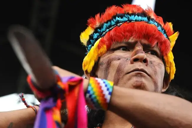 A warrior of Ecuador's indigenous Shuar community protests against a Chinese copper mine set to be built in the country's Amazon region. (Rodrigo BuendiaAFP/Getty Images) Media file: ecuador_indigenous_protest_mine_3_29_2012-1.jpg