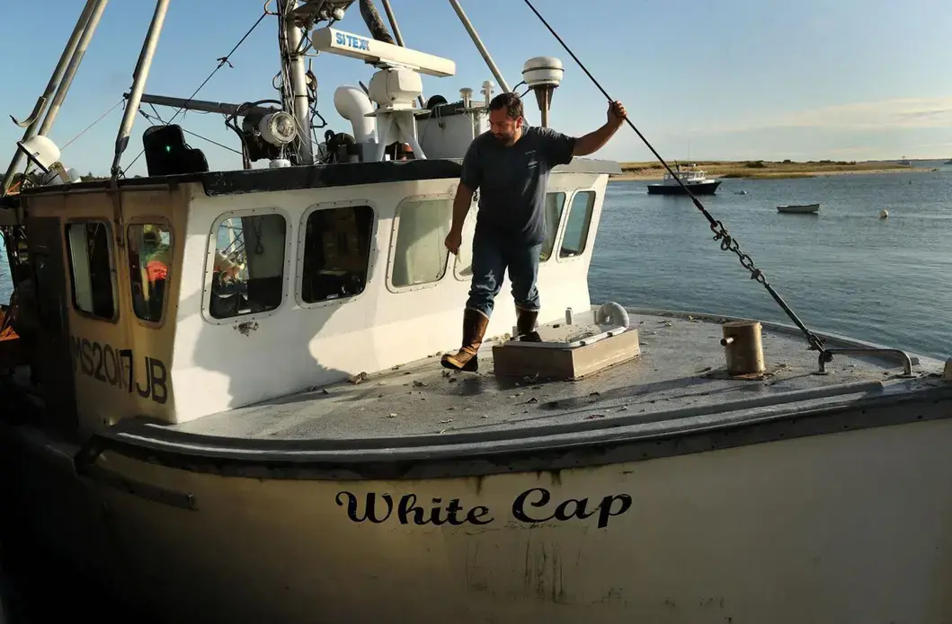 He primarily catches dogfish and skate on his boat White Cap. Image by John Tlumacki. United States, 2019.