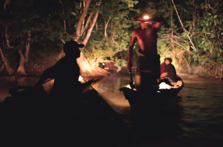 Garimpeiros bring diesel, food, engine parts, and other goods up the Sikini Creek to be distributed to illegal gold mines throughout French Guiana. Photo by Narayan Mahon, French Guiana, 2010. Garimpeiros bring diesel, food, engine parts, and other goods up the Sikini Creek to be distributed to illegal gold mines throughout French Guiana. Photo by Narayan Mahon, French Guiana, 2010.