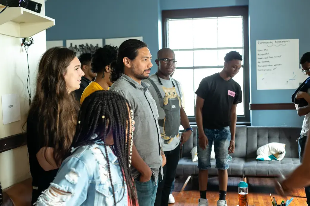 Journalists Evey Wilson and Brian Frank participate in a team-building activity with Free Spirit Media News West students. Image by Claire Seaton. United States, 2019.