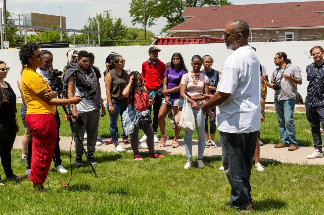 On the community walk in June, the students stopped in Independence Square Park to interview Paul Norrington, a lifelong resident of the North Lawndale. Norrington discussed the history of the neighborhood, including Martin Luther King, Jr.’s time spent there and the Obama Presidential Library. He told the students about a time machine that would be buried in the park, and hoped they would include the films the students would produce for future residents to watch. Image by Claire Seaton. United States, 2019.