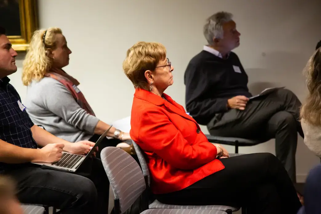 Linda Winslow, Pulitzer Center board member and former PBS NewsHour executive producer, listens to reporting fellow presentations on Day One of Washington Weekend. Image by Claire Seaton. United States, 2019.
