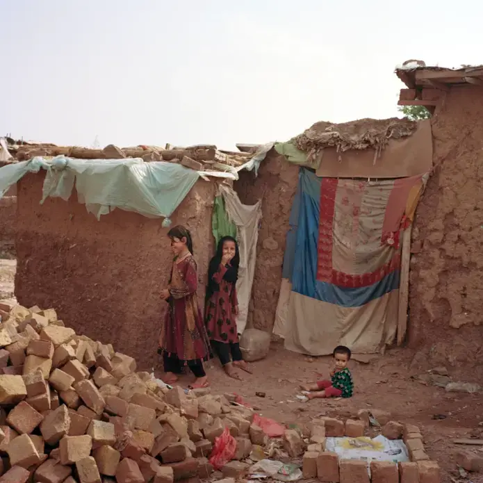 Mud homes shelter the thousands of Afghan refugees who have settled in I-12. Image by Sara Hylton. Pakistan, 2018.